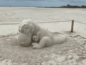 Sanding Ovations sculpture of a baby dinosaur